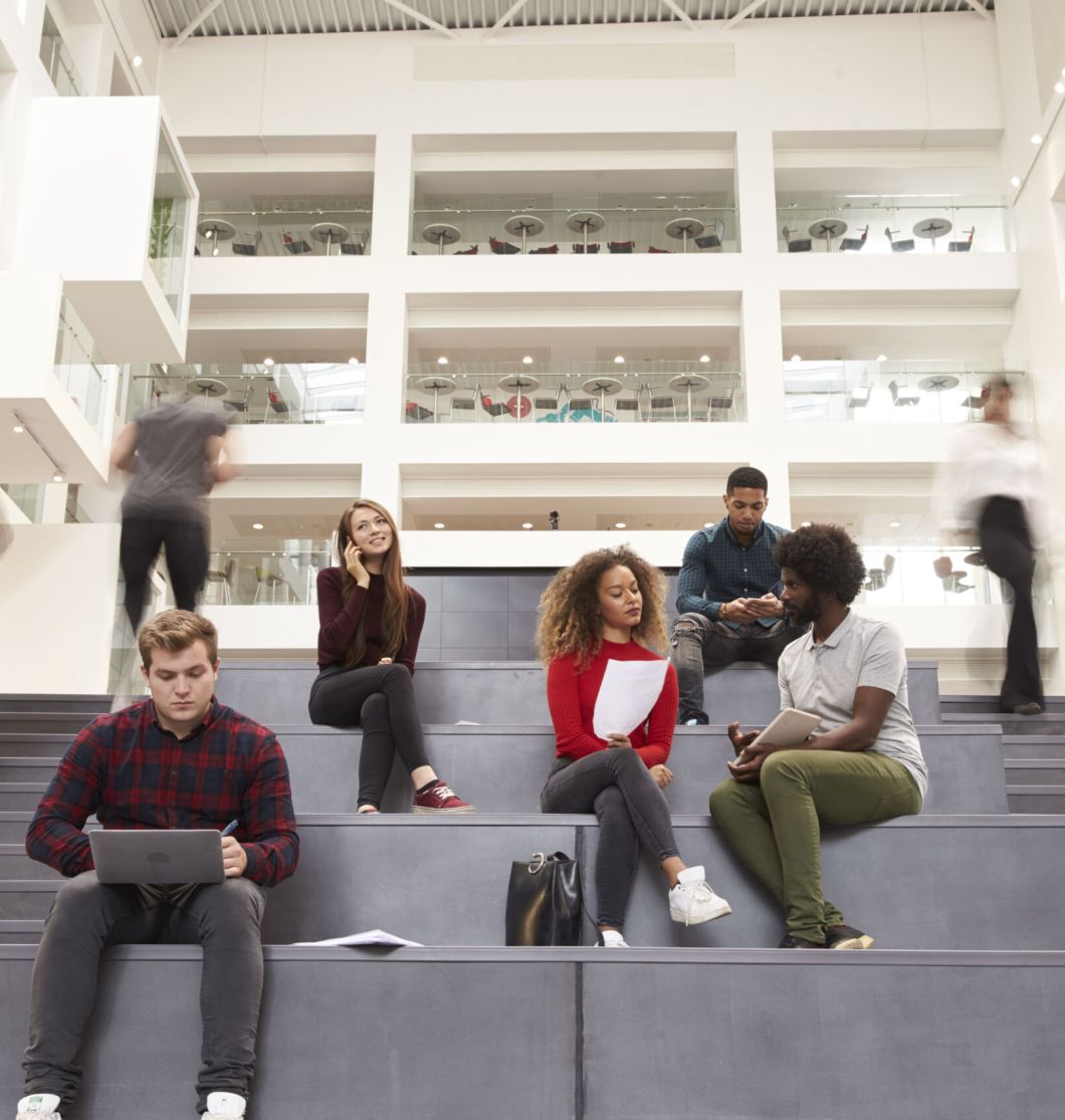 Interior Of Busy University Campus Building With Students